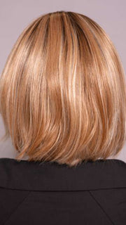 Model is wearing MIRA by AMORE in color CINNAMON FROST R | Warm, medium coppery-brown base with white-blond highlights. The medium brown root color adds a realistic vibe.   
