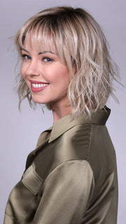 Model is wearing BROADWAY By BELLETRESS in CRUSHED-ALMOND-BLONDE-R | A Soft Neutral Light Blonde with a Light and Medium Blended Root Color