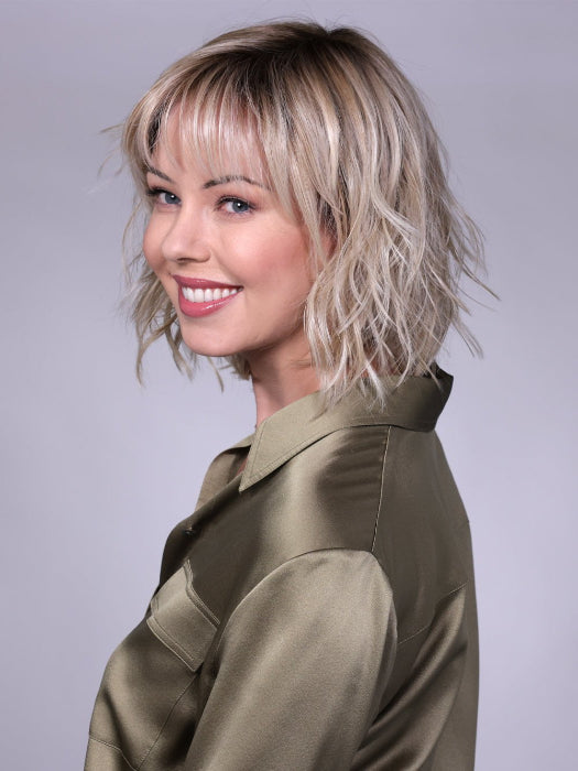 Model is wearing BROADWAY By BELLETRESS in CRUSHED-ALMOND-BLONDE-R | A Soft Neutral Light Blonde with a Light and Medium Blended Root Color