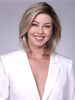 Model is wearing CARDIFF in  MILKSHAKE BLONDE R | A mixture of Light Sandy Brown, Highlighted with Light Ash Blonde with a Hint of Light Platinum Blonde with a Medium Root Color