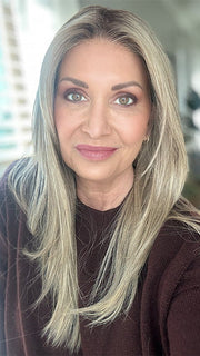 Emily H. @she_sheds_more wearing CHAMPION by BELLE TRESS in color SPARKLING CHAMPAGNE R | Medium Ash Brown roots transition into Shimmering Champagne Blonde characterized by Pale Golden Hues with subtle Ivory and Platinum undertones reminiscent of a sparkling glass of bubbly