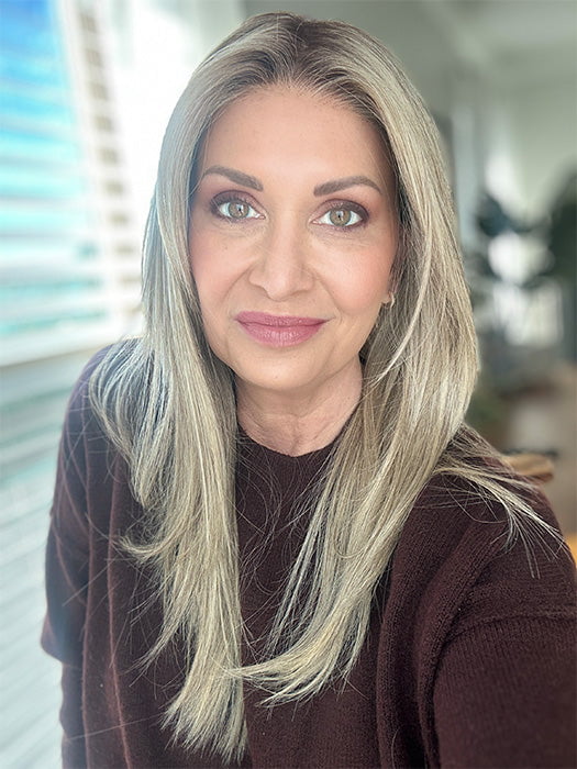 Emily H. @she_sheds_more wearing CHAMPION by BELLE TRESS in color SPARKLING CHAMPAGNE R | Medium Ash Brown roots transition into Shimmering Champagne Blonde characterized by Pale Golden Hues with subtle Ivory and Platinum undertones reminiscent of a sparkling glass of bubbly