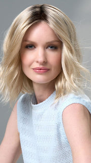 Model is wearing Charlotte Large by ENVY in color SILKY BEIGE |  Light Platinum Blonde with Dark Brown Roots