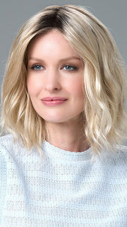 Model is wearing Charlotte Petite by ENVY in color SILKY BEIGE |  Light Platinum Blonde with Dark Brown Roots