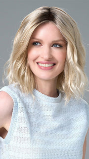 Model is wearing Charlotte Large by ENVY in color SILKY BEIGE |  Light Platinum Blonde with Dark Brown Roots