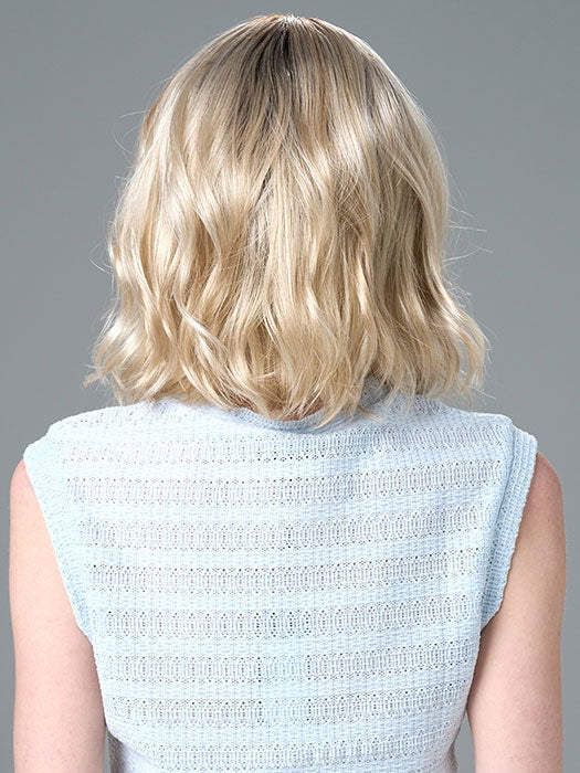 Model is wearing Charlotte Large by ENVY in color SILKY BEIGE |  Light Platinum Blonde with Dark Brown Roots