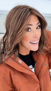 Nichole Corbett @nicholealee wearing Charlotte by Envy in color AMARETTO CREAM | Dark Brown roots with overall Medium Brown base with Honey Blonde highlights