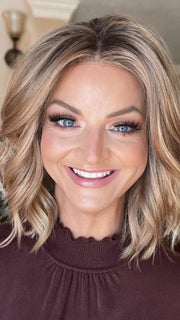 Sandy @i_be_wiggin wearing CHARLOTTE by ENVY BY ALAN EATON in color SAHARA BLONDE | Softer Dark Blonde with Light Golden Blonde, and features Chestnut Roots
