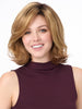 Model is wearing CHLOE by ENVY in color GOLDEN NUTMEG | Medium Brown roots with overall Warm Cinnamon base and Golden Blonde highlights