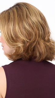 Model is wearing CHLOE by ENVY in color GOLDEN NUTMEG | Medium Brown roots with overall Warm Cinnamon base and Golden Blonde highlights