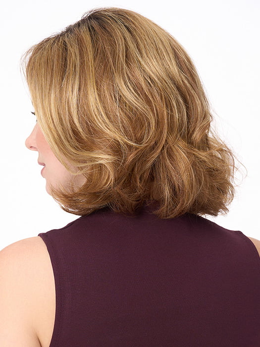 Model is wearing CHLOE by ENVY in color GOLDEN NUTMEG | Medium Brown roots with overall Warm Cinnamon base and Golden Blonde highlights