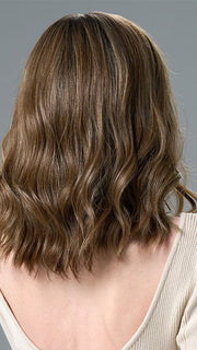Model is wearing COREY by ENVY in HONEY BREEZE | A blend of Cool, Honey Blonde and Multi-Dimensional Medium Brown with Darker Brown Roots