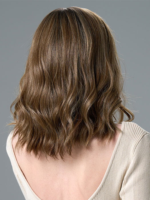 Model is wearing COREY by ENVY in HONEY BREEZE | A blend of Cool, Honey Blonde and Multi-Dimensional Medium Brown with Darker Brown Roots