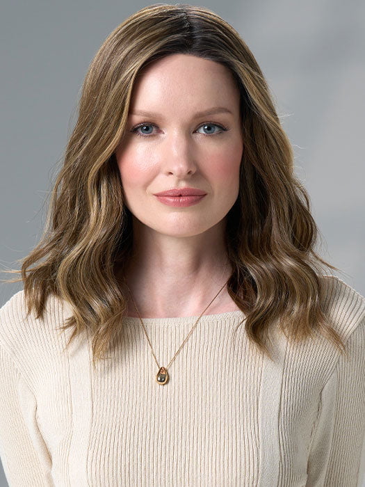 Model is wearing COREY by ENVY in HONEY BREEZE | A blend of Cool, Honey Blonde and Multi-Dimensional Medium Brown with Darker Brown Roots