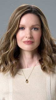 Model is wearing COREY by ENVY in HONEY BREEZE | A blend of Cool, Honey Blonde and Multi-Dimensional Medium Brown with Darker Brown Roots