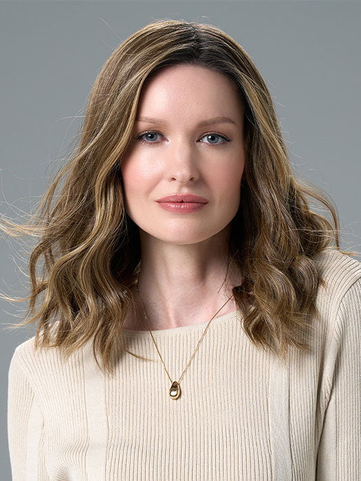 Model is wearing COREY by ENVY in HONEY BREEZE | A blend of Cool, Honey Blonde and Multi-Dimensional Medium Brown with Darker Brown Roots