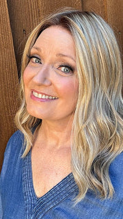 Mel B. @mels.be.ageless wearing Corey by Envy in shade CHAMPAGNE SHADOW | Soft Dark Blonde with Platinum Highlights and Chestnut Roots