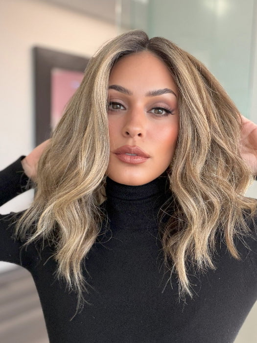 Model is wearing COREY by ENVY in color HONEY BREEZE | A blend of Cool, Honey Blonde and Multi-Dimensional Medium Brown with Darker Brown Roots
