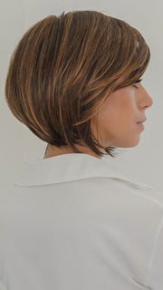 Model is wearing POISED by TRESSALLURE in color 17/23/R8 | Beige Blonde and Auburn Blended with Medium Brown Roots