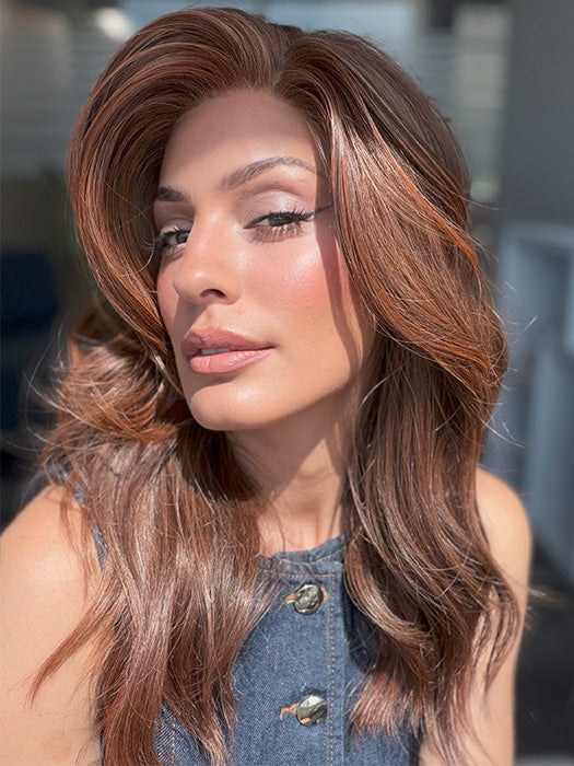 Model is wearing DECADENT DIVA by RAQUEL WELCH in shade RL32/31 CINNABAR | Medium Dark Auburn Evenly Blended with Medium Light Auburn