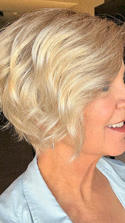 Susan Sparks @an_affair_with_hair wearing DONNA by ENVY in color SILKY BEIGE | Light Platinum Blonde with Dark Brown Root (indoor lighting)