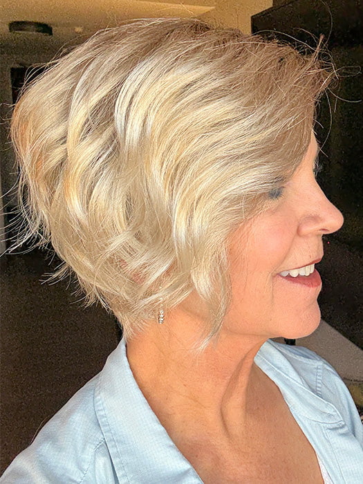 Susan Sparks @an_affair_with_hair wearing DONNA by ENVY in color SILKY BEIGE | Light Platinum Blonde with Dark Brown Root (indoor lighting)