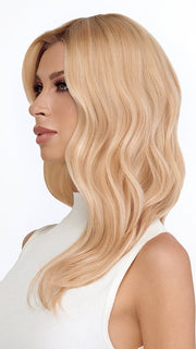 Model is wearing DYNAMIC by TRESSALLURE in color SS24/102/R12 | Golden Blonde Highlighted Platinum Rooted Light Golden Brown