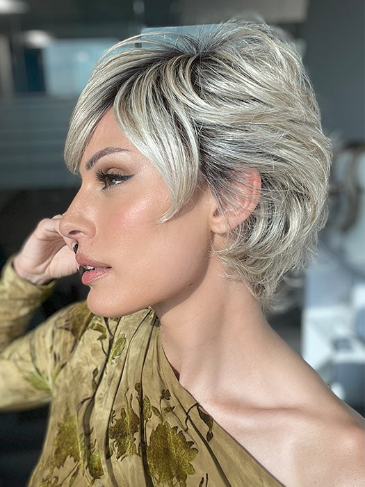 Roxie is wearing EDGE FACTOR by GABOR in color GF19-23SS BISCUIT | Light Ash Blonde Evenly Blended with Cool Platinum Blonde with Dark Roots