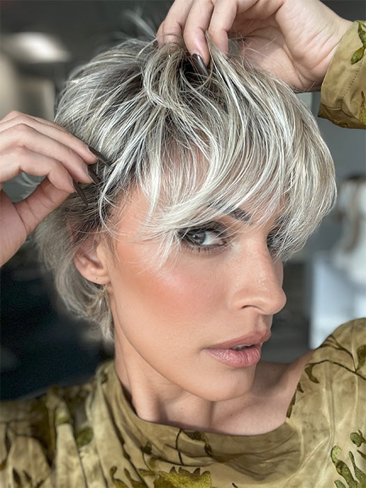 Roxie is wearing EDGE FACTOR by GABOR in color GF19-23SS BISCUIT | Light Ash Blonde Evenly Blended with Cool Platinum Blonde with Dark Roots