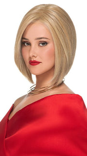 A medium asymmetrical bob with sleek hair that is precisely cut into face-flattering layers