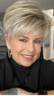 Donna @style.me.ageless wearing TIFFANY by ENVY BY ALAN EATON in color SILKY BEIGE | Light Platinum Blonde with Dark Brown Roots