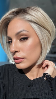 Roxie wearing STRAIGHT UP WITH A TWIST By RAQUEL WELCH in SS19/23 SHADED BISCUIT | Cool Platinum blonde with subtle highlights and medium brown roots