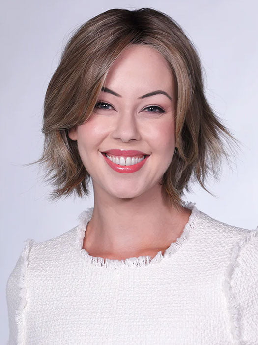 Model is wearing FERRARI By BELLETRESS in color SUNKISSED ALMOND R | A blend of Medium and Light Brown with Light Gold Blonde Highlights and a hint of Cooler Blonde, rooted with Medium and Light Brown