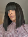 Model is wearing FRINGE EFFECT by HAIRDO in color R2 EBONY | Black