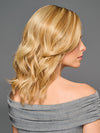Model is wearing RAISE THE BAR in color GF14-22SS SS WHEAT| Dark Blonde Evenly Blended with Platinum Blonde with Dark Roots