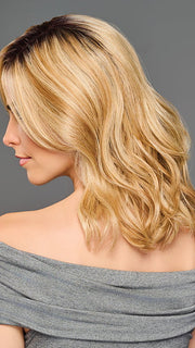 Model is wearing RAISE THE BAR in color GF14-22SS SS WHEAT| Dark Blonde Evenly Blended with Platinum Blonde with Dark Roots