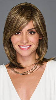 Model is wearing ILLUMINATION by GABOR in color BROWN-BLONDE | Medium to Light Brown with Salon Highlights