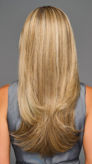 Model is wearing STAY OUT LATE in color GF12-22SS SS CAPPUCCINO | A radiant blend of warm blonde tones with sunlit highlights and soft dimension