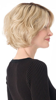 Model is wearing GIA by ENVY in color SILKY BEIGE | Light Platinum Blonde with Dark Brown Roots