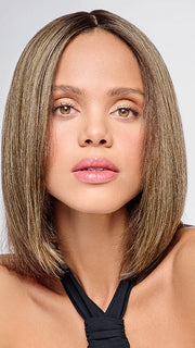 Model is wearing HD 10in AU NATUREL TOPPER in color SS8/12 ICED MOCHA | Medium Brown shaded with Dark Blonde