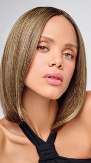 Model is wearing HD 10in AU NATUREL TOPPER in color SS8/12 ICED MOCHA | Medium Brown shaded with Dark 