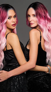 Model is wearing BUBBLEGUM BABE | Dark roots transition into a soft raspberry shade and gradually pales to soft pastel ends. 