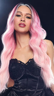 Model is wearing BUBBLEGUM BABE | Dark roots transition into a soft raspberry shade and gradually pales to soft pastel ends. 
