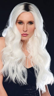 Model is wearing ETHEREAL ICE | Natural dark roots melt into an icy white shade for a beautiful contrast. 
