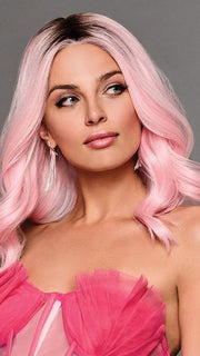 The layered hair has a loose wave pattern that falls to the shoulders