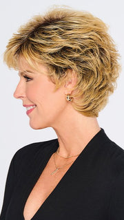 A short shag hairstyle with razor-cut layers and voluminous waves