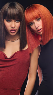 Model 1 is wearing color SS13/88T DEEP ROOT GLAZED PECAN | deep, dark brown root that blends into a mix of warm pecan brown and light golden blonde tones. Model 2 is wearing SS31 ROOTED FLAME | Rich Red with orange highlights throughout