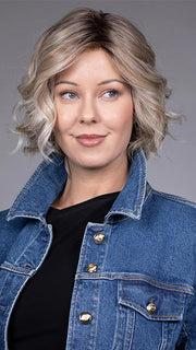 Model is wearing HOUSTON in color MILKSHAKE BLONDE R | A mixture of Light Sandy Brown, Highlighted with Light Ash Blonde with a Hint of Light Platinum Blonde with a Medium Root Color