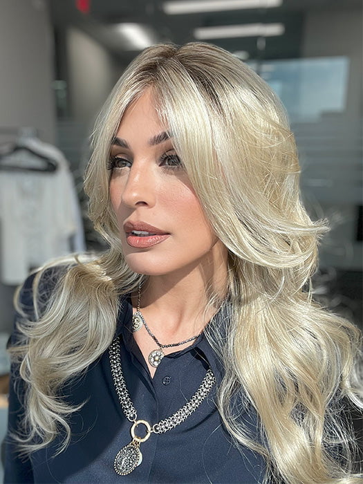Model is wearing HANA by NORIKO in color Sandy Cream Blond R | Soft golden sand tones with shaded roots. The color is blended with beige brown, honey, and creamy blonde and transitions to lighter shades for a warm honey blonde color.
