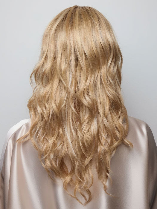 Model is wearing HANA by NORIKO in color Light Ash Blond R | Cream Ash Blonde with ash brown and white-grey roots that blend into a variety of ash blonde tones, including ash pearl blonde, creamy ivory, and pale cream